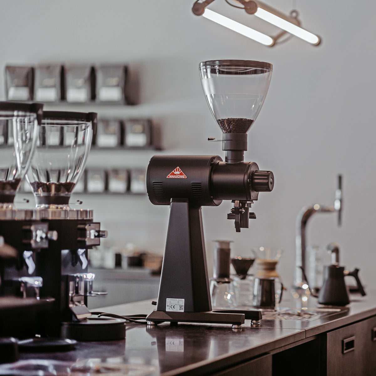 Mahlkonig EK43 98mm flat burr shop grinder in a lifestyle setting
