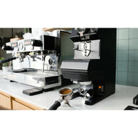 Image of Puqpress Gen 5 M2 Automatic Tamper for Simonelli Mythos Grinders - Voltage Coffee Supply™